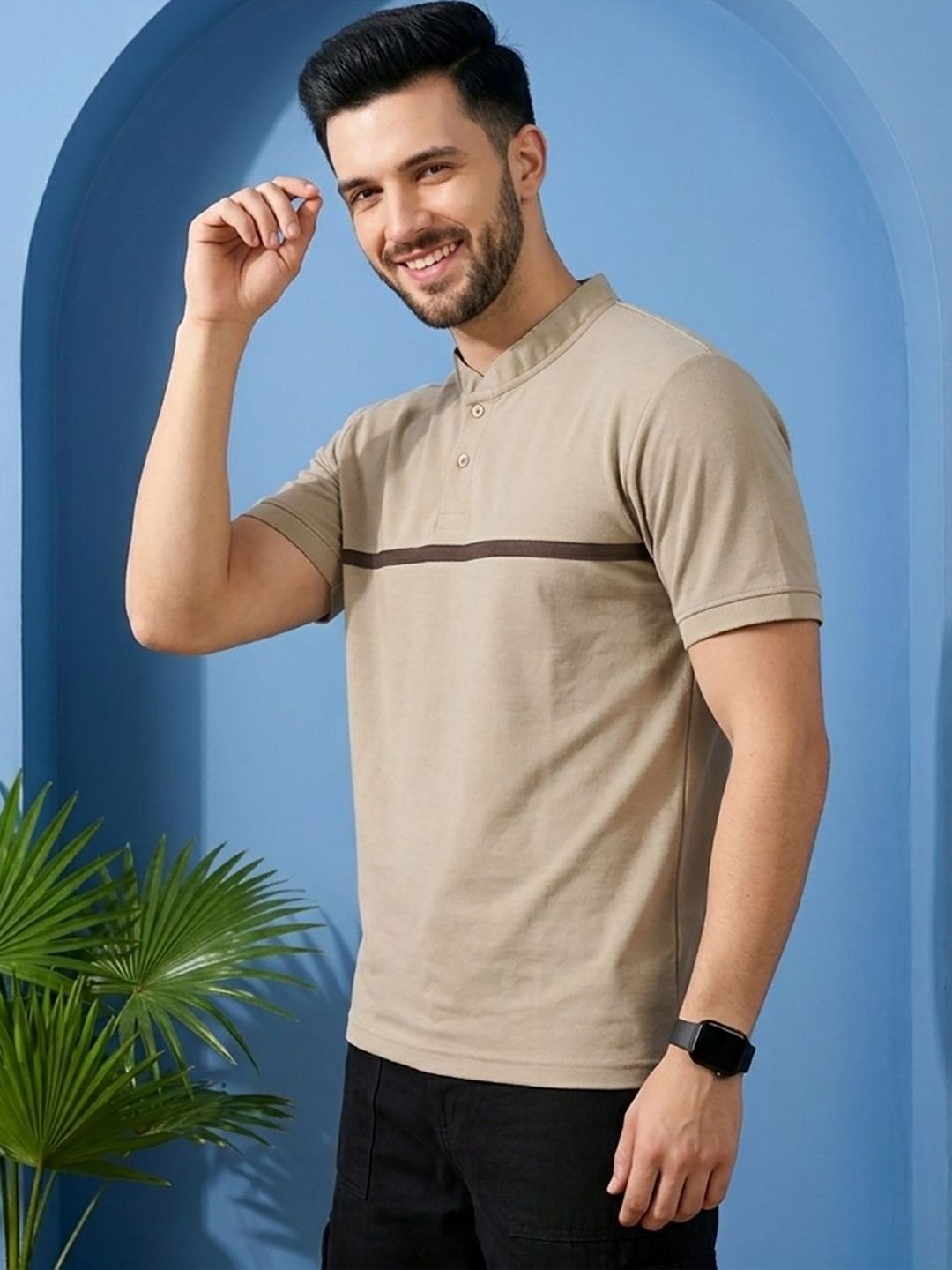 Catalog still of a model in a stone polo shirt